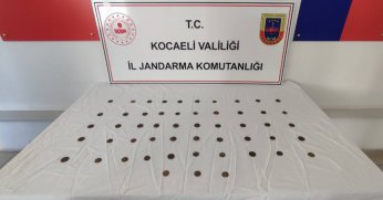 Üzerinden 53 sikke çıktı