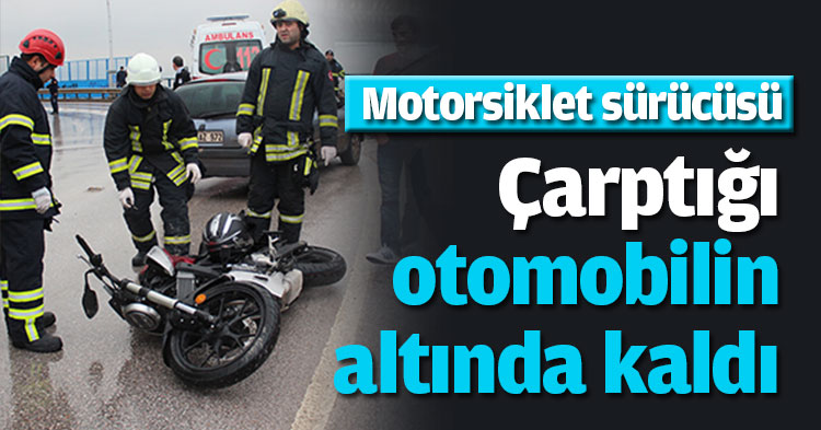 Çarptığı otomobilin altında kaldı