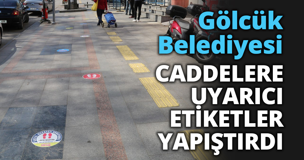 GÖLCÜK BELEDİYESİ CADDELERE UYARICI ETİKETLER YAPIŞTIRDI