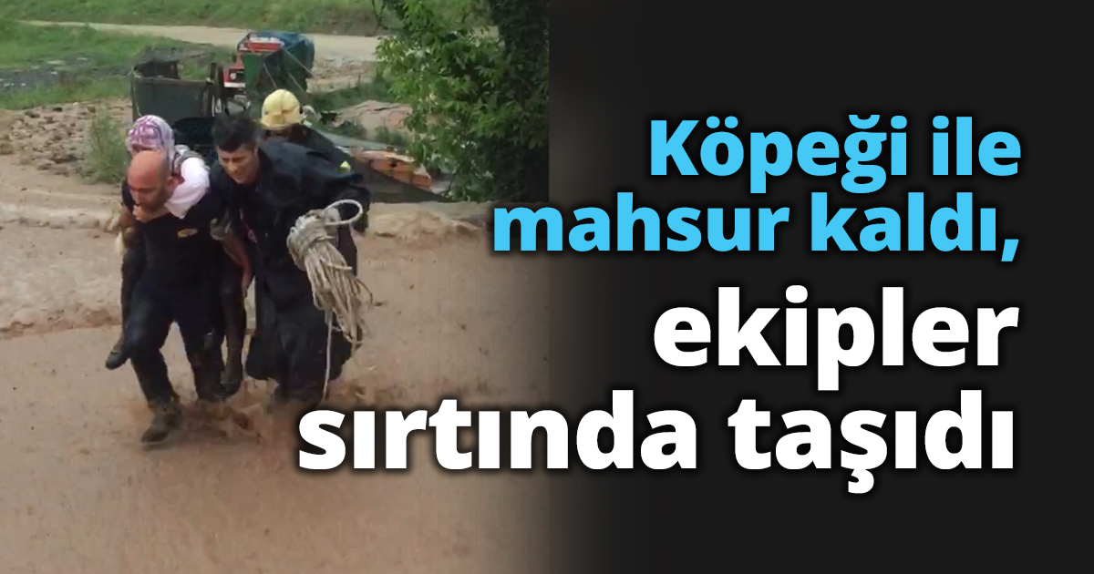 Köpeği ile mahsur kaldı, ekipler sırtında taşıdı