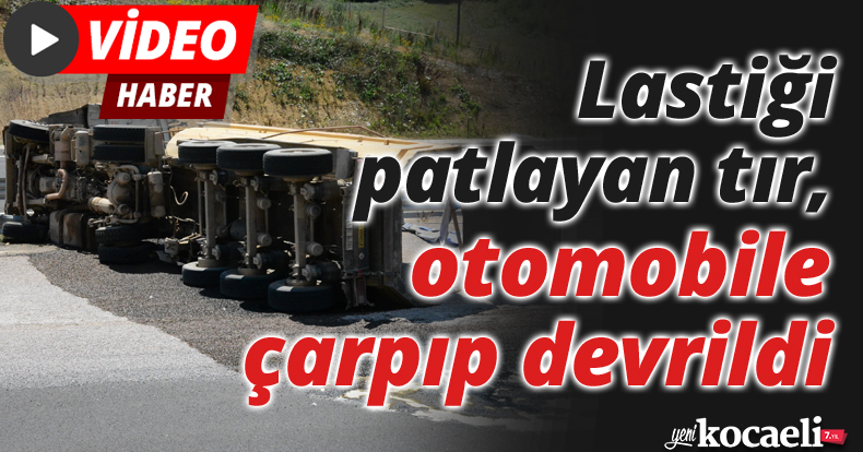 Lastiği patlayan tır, otomobile çarpıp devrildi