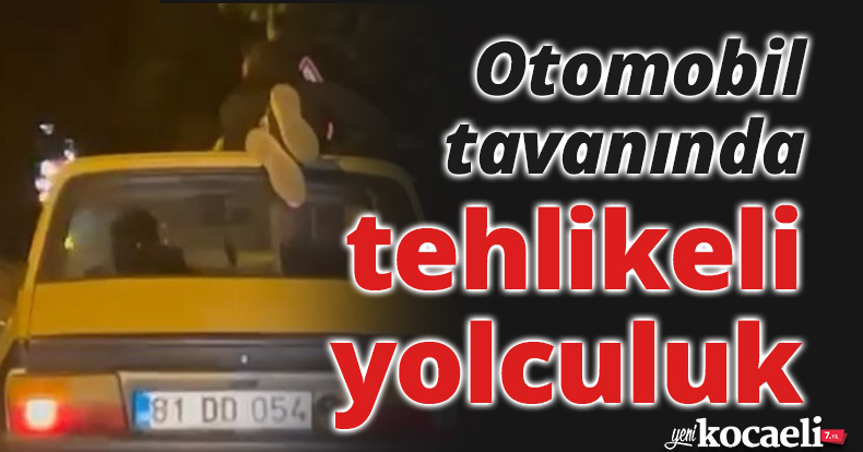 Otomobil tavanında tehlikeli yolculuk