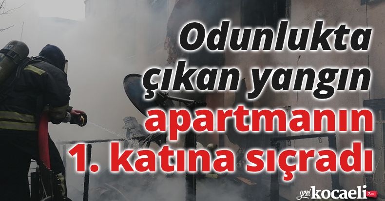 Odunlukta çıkan yangın apartmanın 1. katına sıçradı