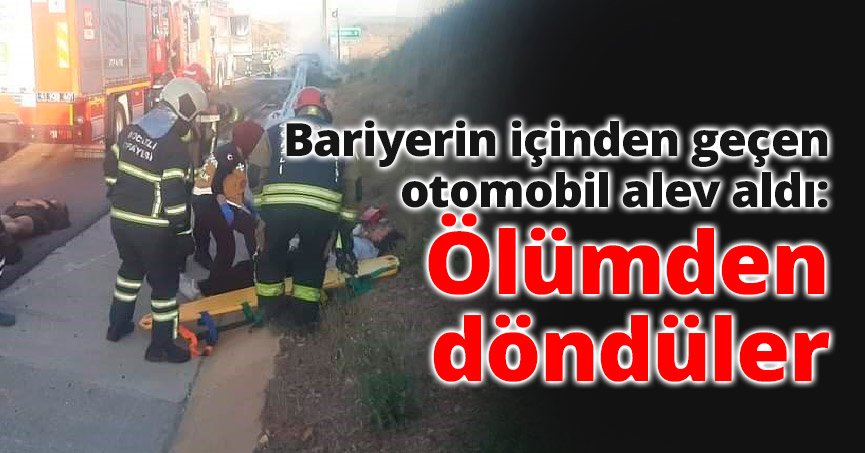 Bariyerin içinden geçen otomobil alev aldı: Ölümden döndüler