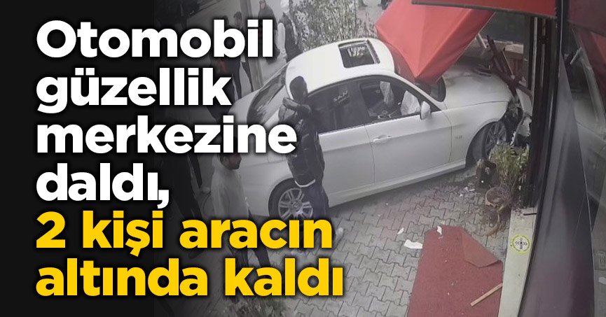 Otomobil güzellik merkezine daldı, 2 kişi aracın altında kaldı