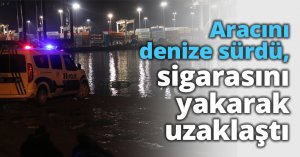 Aracını denize sürdü, sigarasını yakarak uzaklaştı