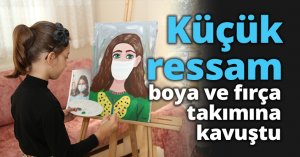 Küçük ressam, boya ve fırça takımına kavuştu