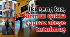 İki genç kız, kırmızı ışıkta çapraz ateşe tutulmuş
