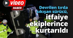 TEM çıkışında devrilen tırda sıkışan sürücü, itfaiye ekiplerince kurtarıldı