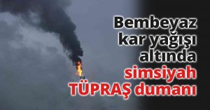 Bembeyaz kar yağışı altında, simsiyah TÜPRAŞ dumanı