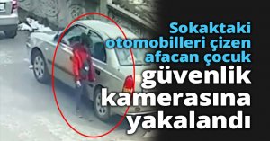 Sokaktaki otomobilleri çizen afacan çocuk, güvenlik kamerasına yakalandı