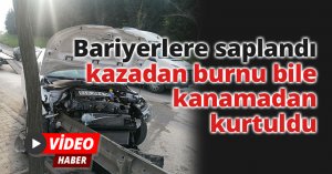 Bariyerlere saplandı, kazadan burnu bile kanamadan kurtuldu