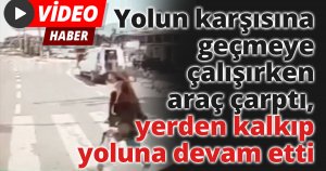 Yolun karşısına geçmeye çalışırken araç çarptı, yerden kalkıp yoluna devam etti