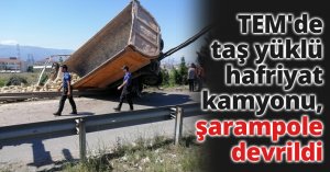 TEM'de taş yüklü hafriyat kamyonu, şarampole devrildi