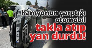 Kamyonun çarptığı otomobil takla atıp yan durdu