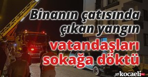 Binanın çatısında çıkan yangın vatandaşları sokağa döktü