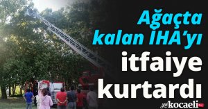 Ağaçta kalan İHA’yı itfaiye kurtardı