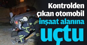 Kontrolden çıkan otomobil inşaat alanına uçtu