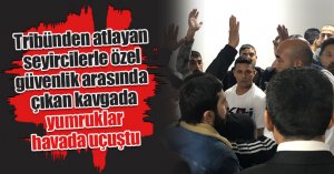 Tribünden atlayan seyircilerle özel güvenlik arasında çıkan kavgada yumruklar havada uçuştu