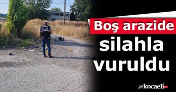Boş arazide silahla vuruldu