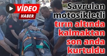 Savrulan motosikletli tırın altında kalmaktan son anda kurtuldu