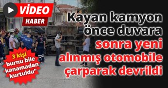 Kayan kamyon önce duvara, sonra yeni alınmış otomobile çarparak devrildi: 3 kişi burnu bile kanamadan kurtuldu