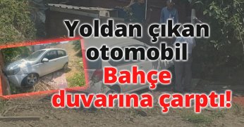 Yoldan çıkan otomobil bahçe duvarına çarptı