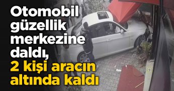 Otomobil güzellik merkezine daldı, 2 kişi aracın altında kaldı
