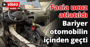 Bariyer otomobilin içinden geçti