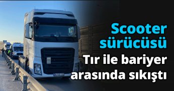 Scooter sürücüsü tır ile bariyer arasında sıkıştı