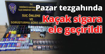 Pazar tezgahında kaçak sigara ele geçirildi