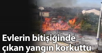 Evlerin bitişiğinde çıkan yangın korkuttu